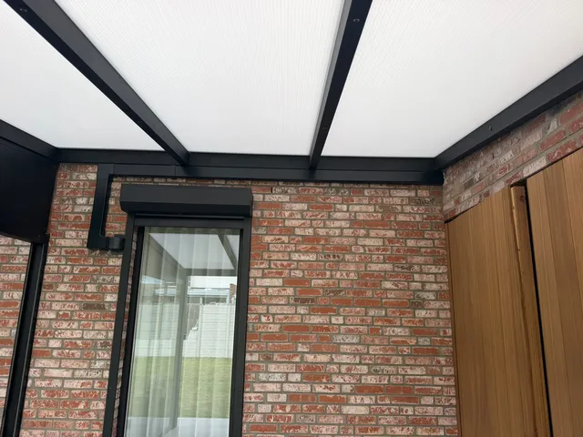 Leidinggoot weggewerkt onder de terrasoverkapping, Heusden-Zolder